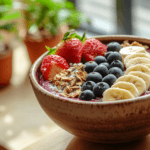 A beautifully prepared açaí bowl with fresh fruit and granola.